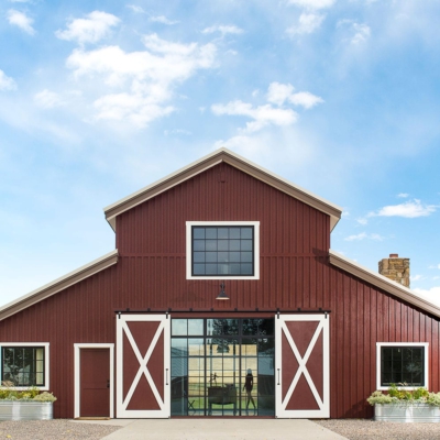 Steel residential storefront window wall in a barn