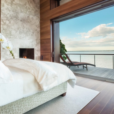 Pocketing lift and slide doors overlooking the harbour from a bedroom