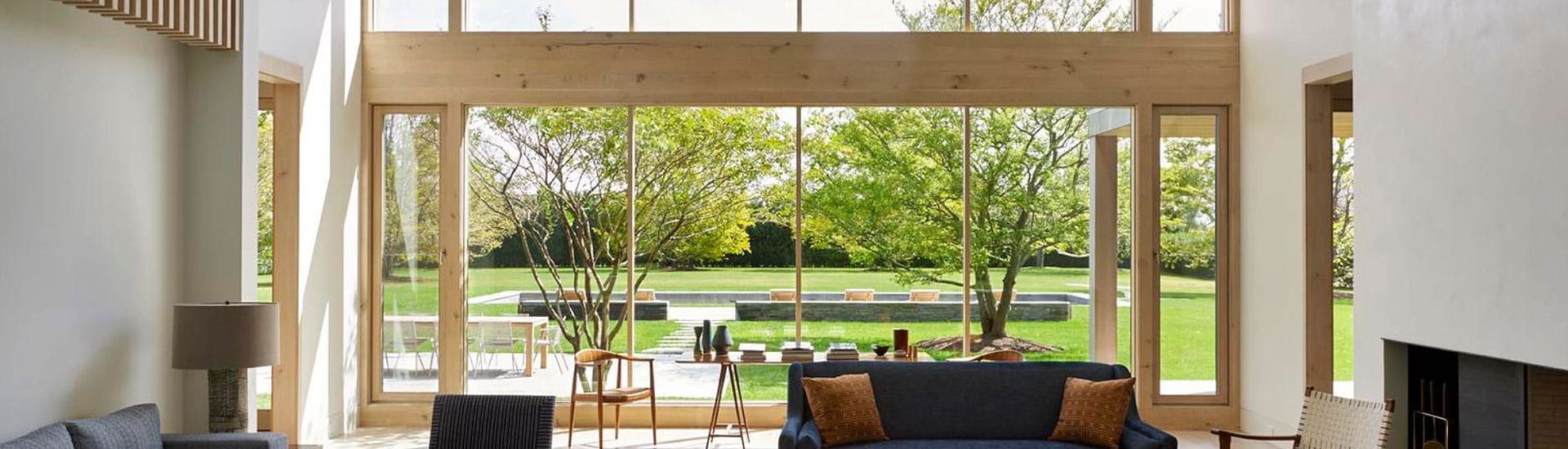 Wood Clad Windows and Doors with narrow mullion profiles looking out to yard