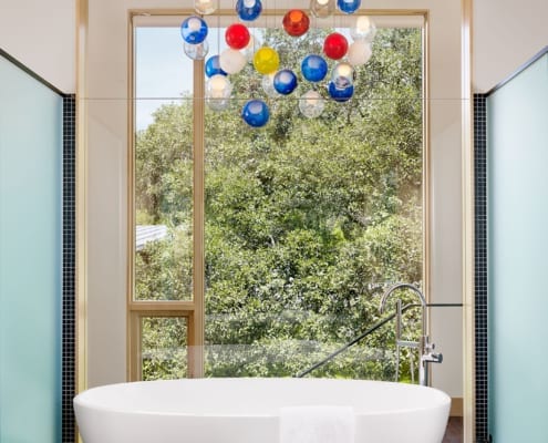 Wood storefront window in bathroom of Hog Pen Creek Residence on the lake front