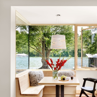 Corner wood storefront with integrated casement window in breakfast nook