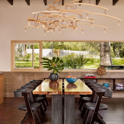 Horizontal wood storefront with integrated casement window in dining room