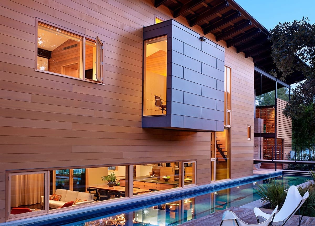 Back-lit modern windows and pool at dusk - Hog Pen Creek Residence