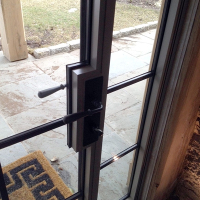 Lock box on steel hinged entry door