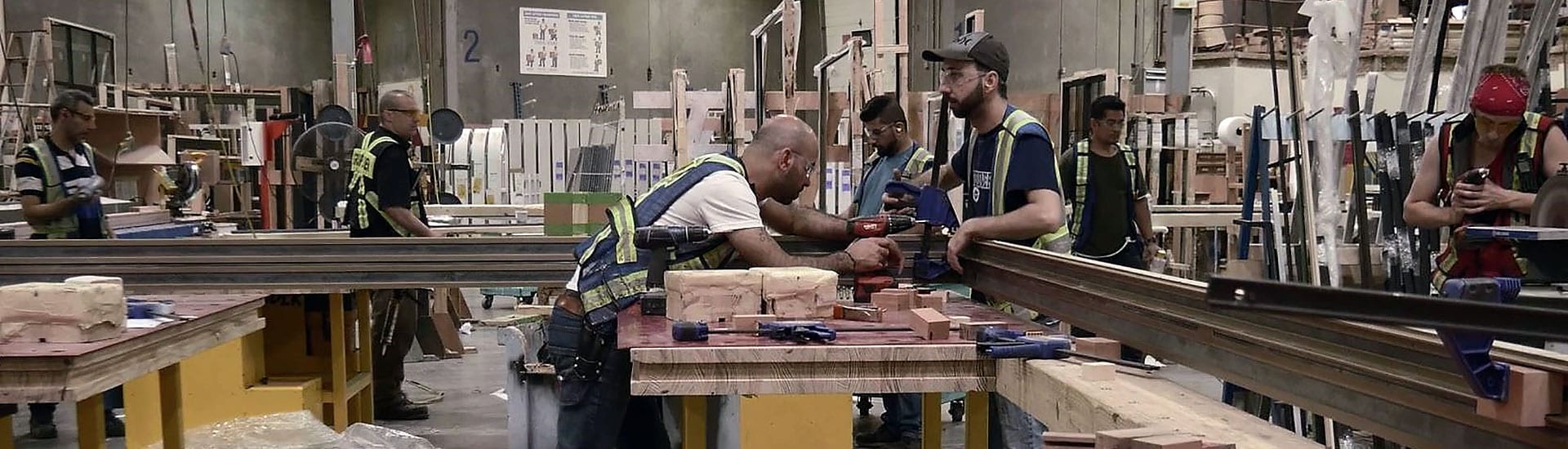 View of workers in metal window shop