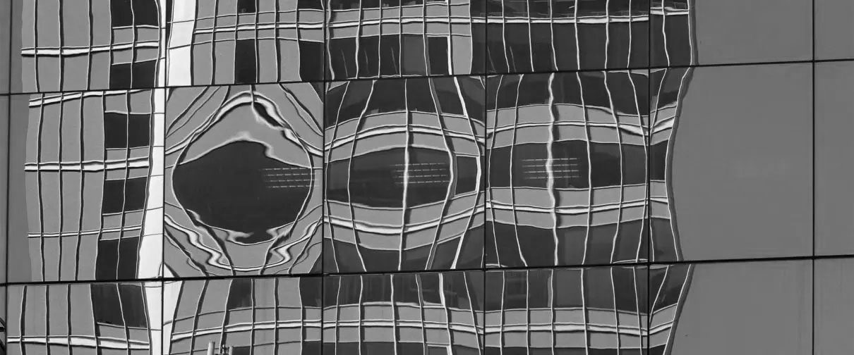 Distorted glass shown on skyrscraper windows.