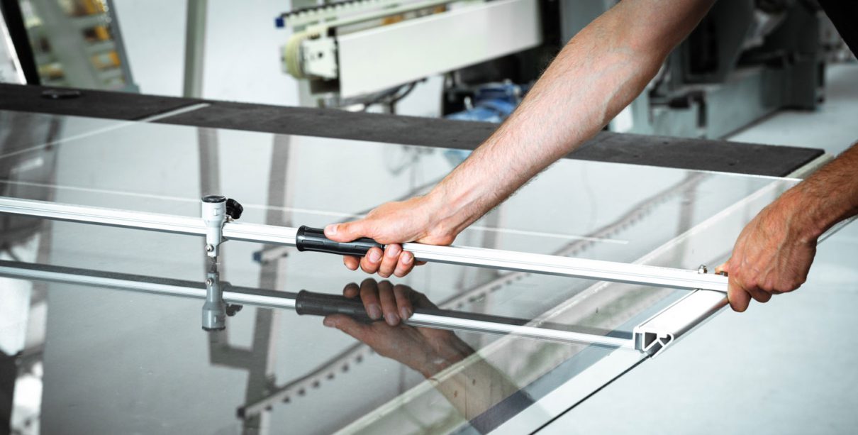 Man working with custom glass windows.