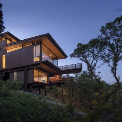 Modern Texas home with residential window walls at night